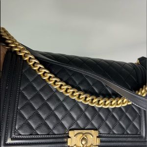 Authentic CHANEL Calfskin Quilted Medium Boy Flap in Black.